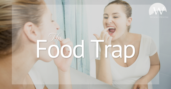 The Food Trap woman touching teeth